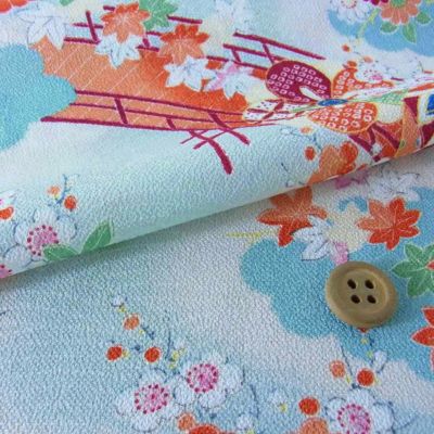 一越ちりめん・波文様に花(水色) 10cm単位 切り売り