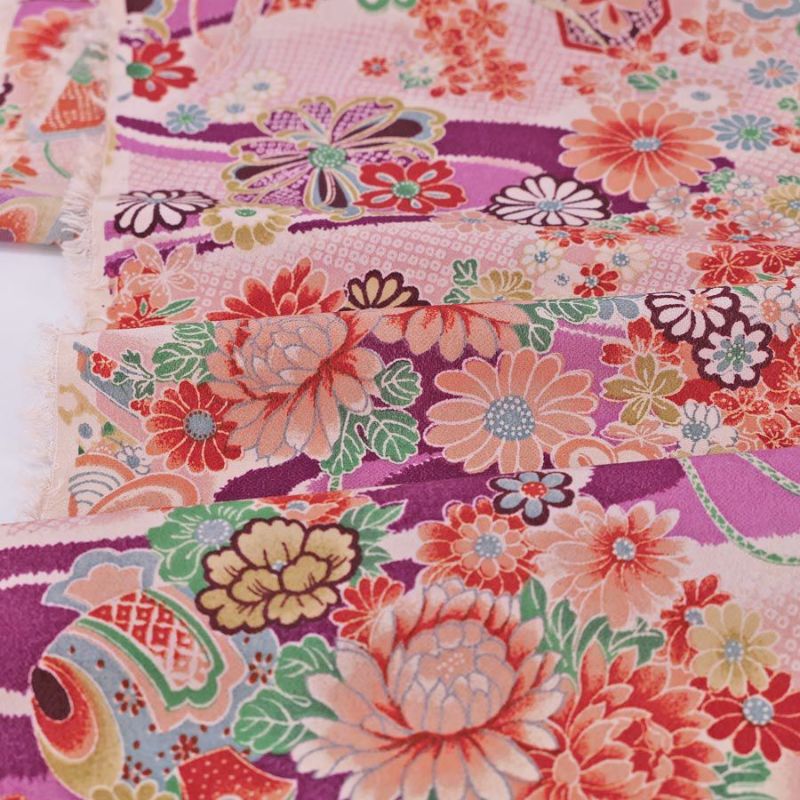 一越ちりめん生地 しぼりに花のし小槌文様(紫)