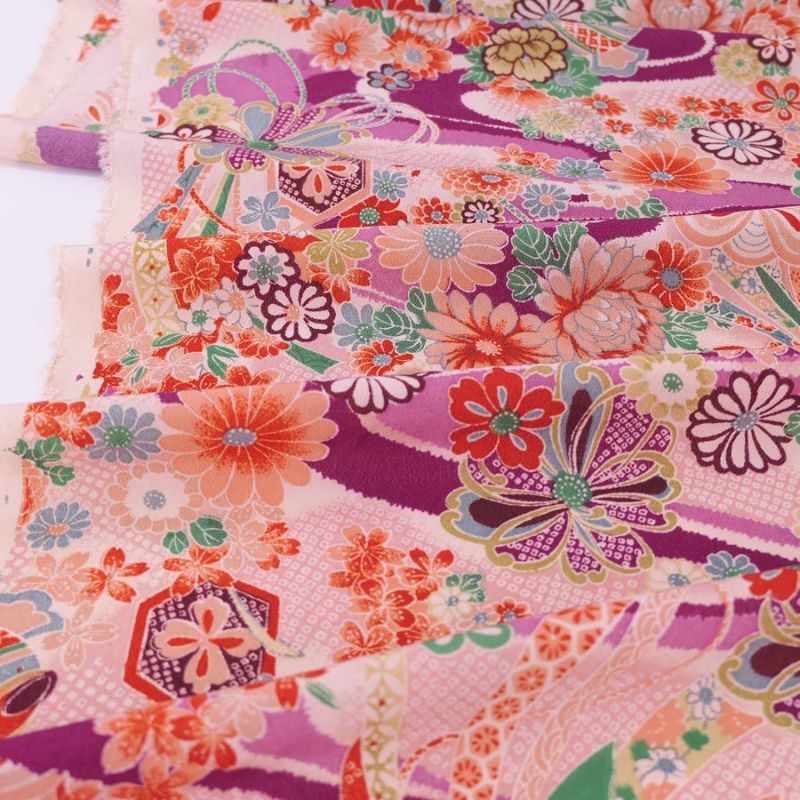 一越ちりめん生地 しぼりに花のし小槌文様(紫)