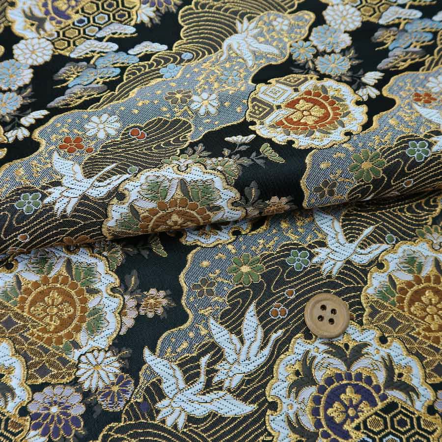 金襴生地(金らん) 道長取りに雪輪と鶴(黒)