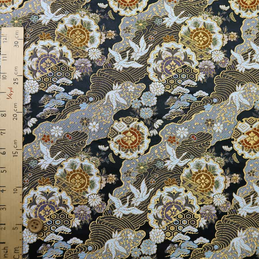 金襴生地(金らん) 道長取りに雪輪と鶴(黒)