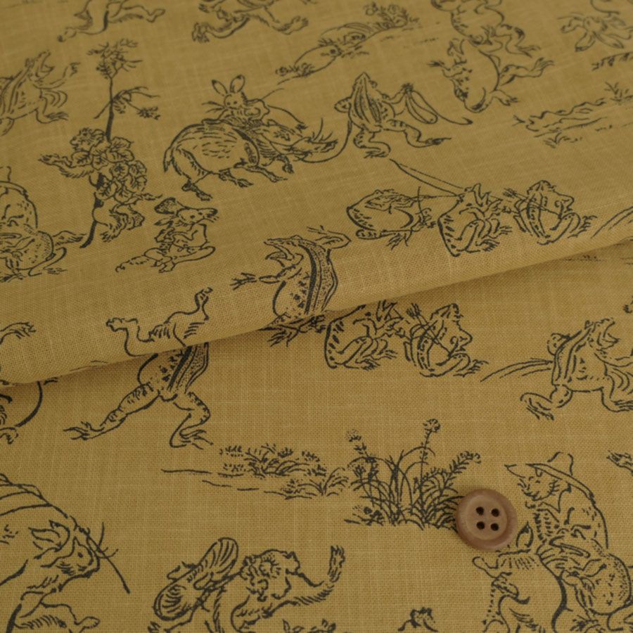 和柄コットン生地・鳥獣人物戯画(からし色) 10cm単位 切り売り |生地