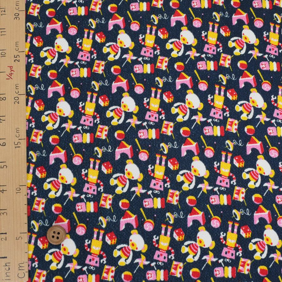 ちりめん生地 おもちゃのパレード(紺) 10cm単位 切り売り