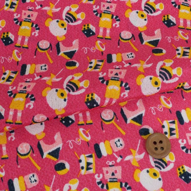 ちりめん生地 おもちゃのパレード(ピンク) 10cm単位 切り売り