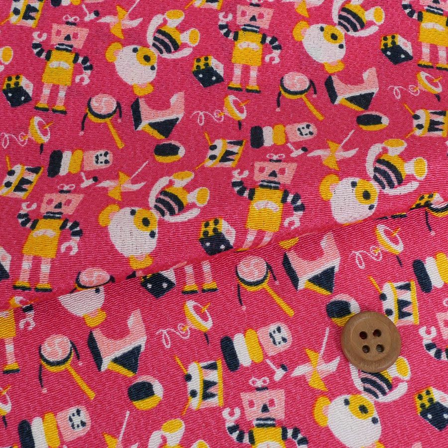 ちりめん生地 おもちゃのパレード(ピンク) 10cm単位 切り売り