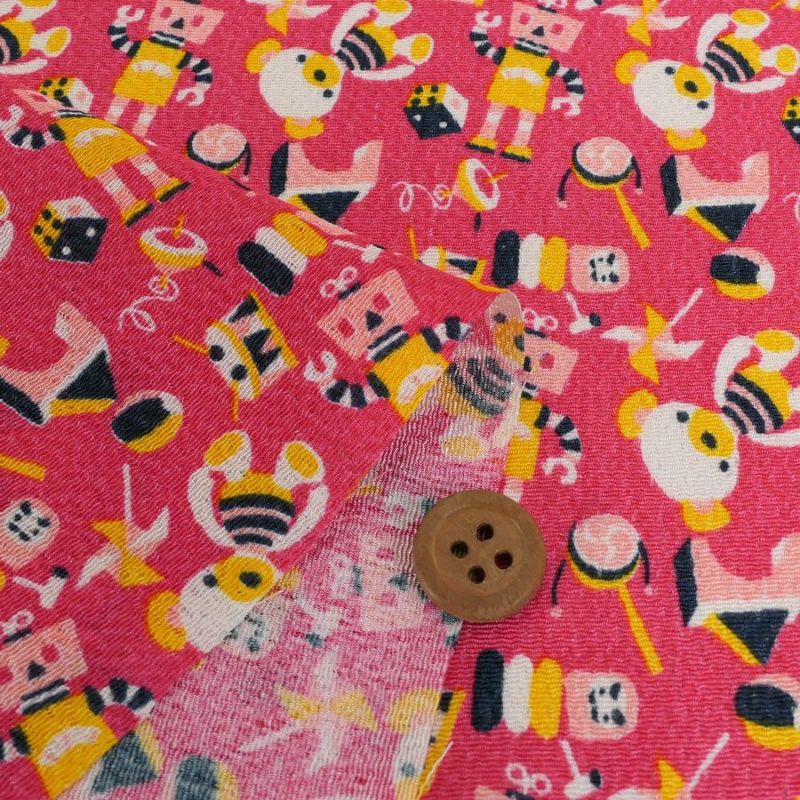 ちりめん生地 おもちゃのパレード(ピンク) 10cm単位 切り売り