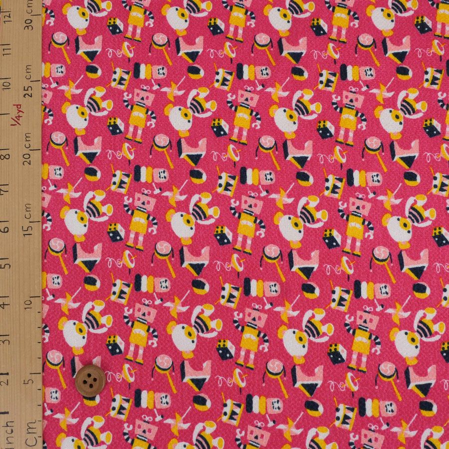 ちりめん生地 おもちゃのパレード(ピンク) 10cm単位 切り売り
