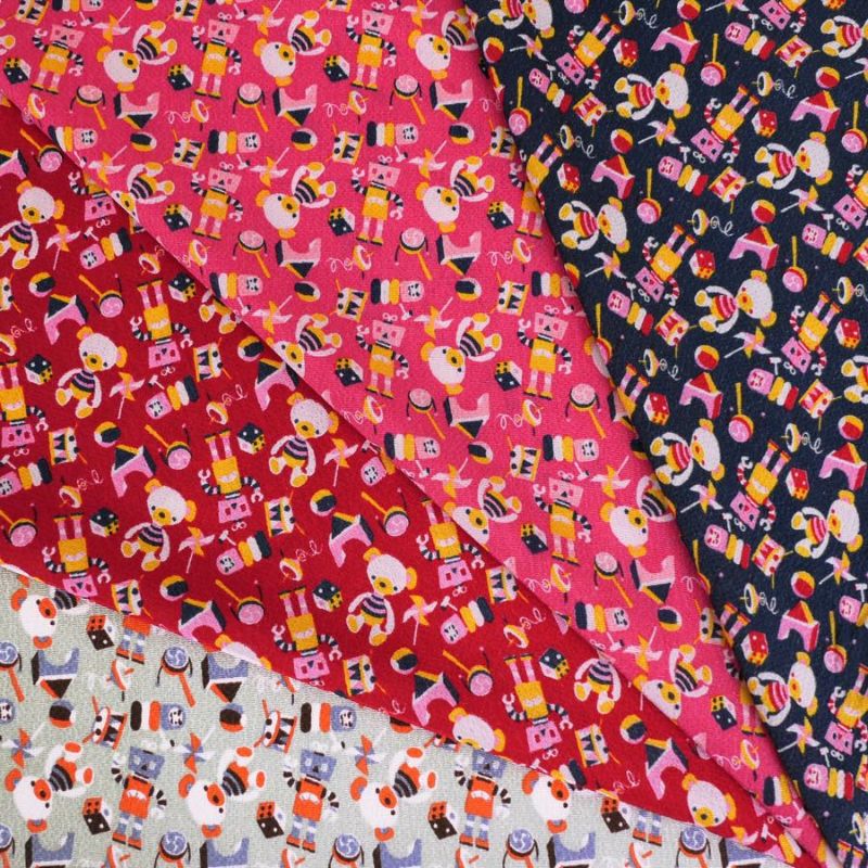 ちりめん生地 おもちゃのパレード(赤) 10cm単位 切り売り