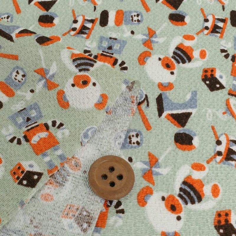 ちりめん生地 おもちゃのパレード(うす青磁) 10cm単位 切り売り