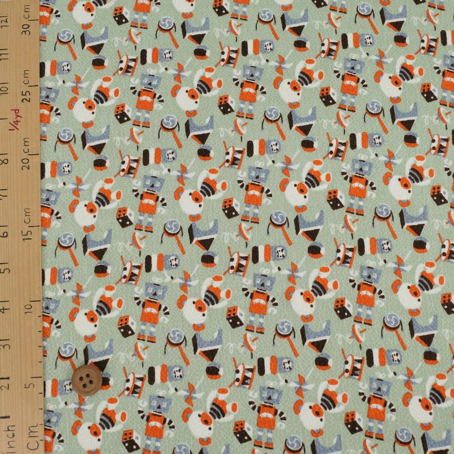 ちりめん生地 おもちゃのパレード(うす青磁) 10cm単位 切り売り