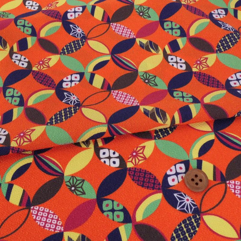ポリちりめん生地 彩り七宝(柿色) 10cm単位 切り売り よさこい衣装・洋服に 水洗い可能なポリエステル縮緬 七宝模様