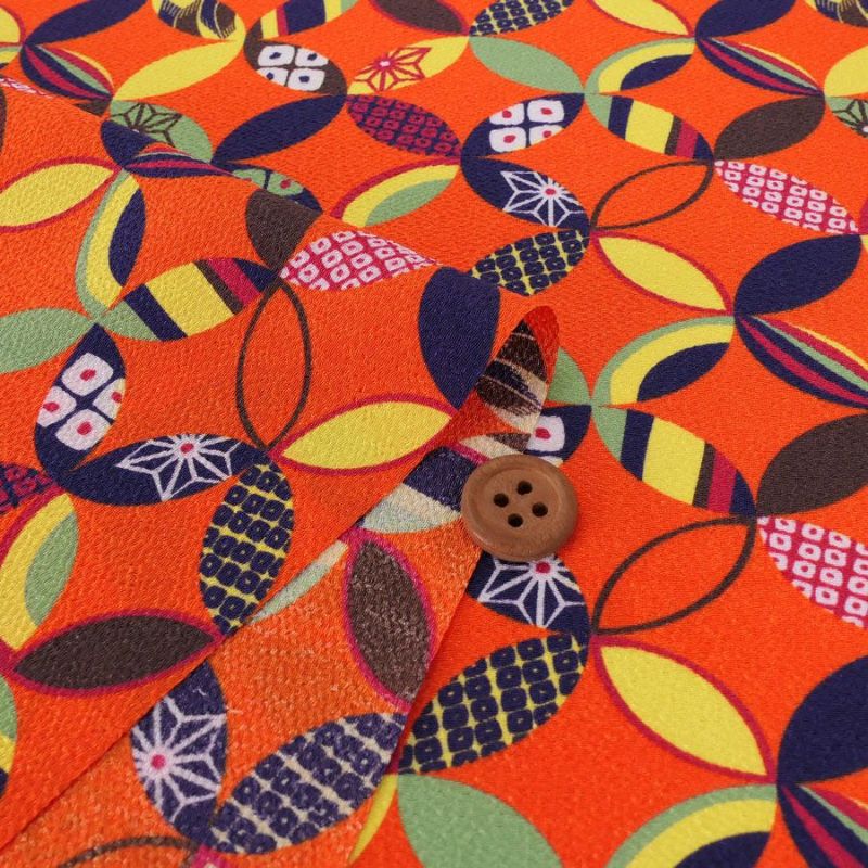 ポリちりめん生地 彩り七宝(柿色) 10cm単位 切り売り よさこい衣装・洋服に 水洗い可能なポリエステル縮緬 七宝模様