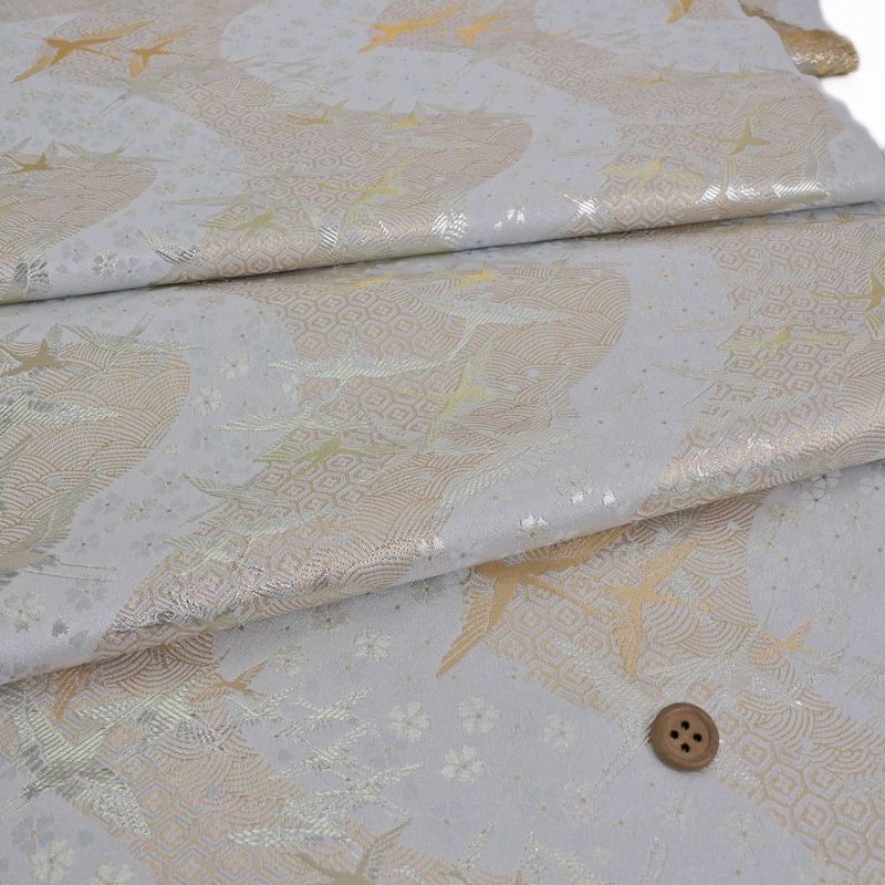 金襴生地(金らん) 吉祥流水に鶴(白銀) 10cm単位 切り売り 吉祥文様の鶴と桜柄上品な西陣織物 慶事の小物やテーブル回りに