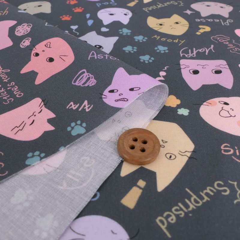 コットン生地 カラフル猫面相(グレー) 10cm単位 切り売り ネコ柄生地グレイ 猫柄木綿生地 ポップなねこ柄布 noraモエラン