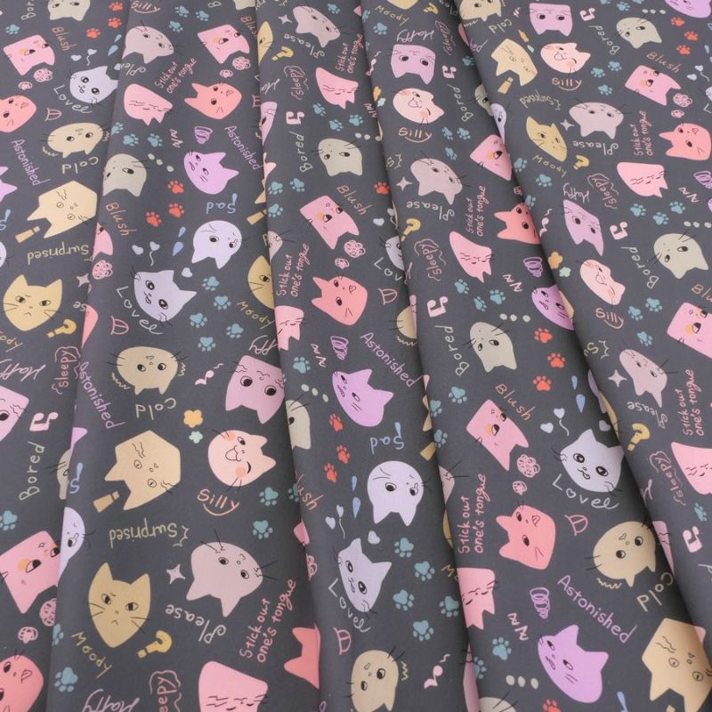 コットン生地 カラフル猫面相(グレー) 10cm単位 切り売り ネコ柄生地グレイ 猫柄木綿生地 ポップなねこ柄布 noraモエラン