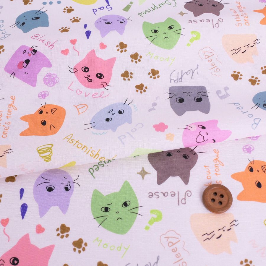 コットン生地 カラフル猫面相(白) 10cm単位 切り売り ネコ柄生地 猫柄木綿生地 ねこ柄布地 かわいい ポップな柄 nora