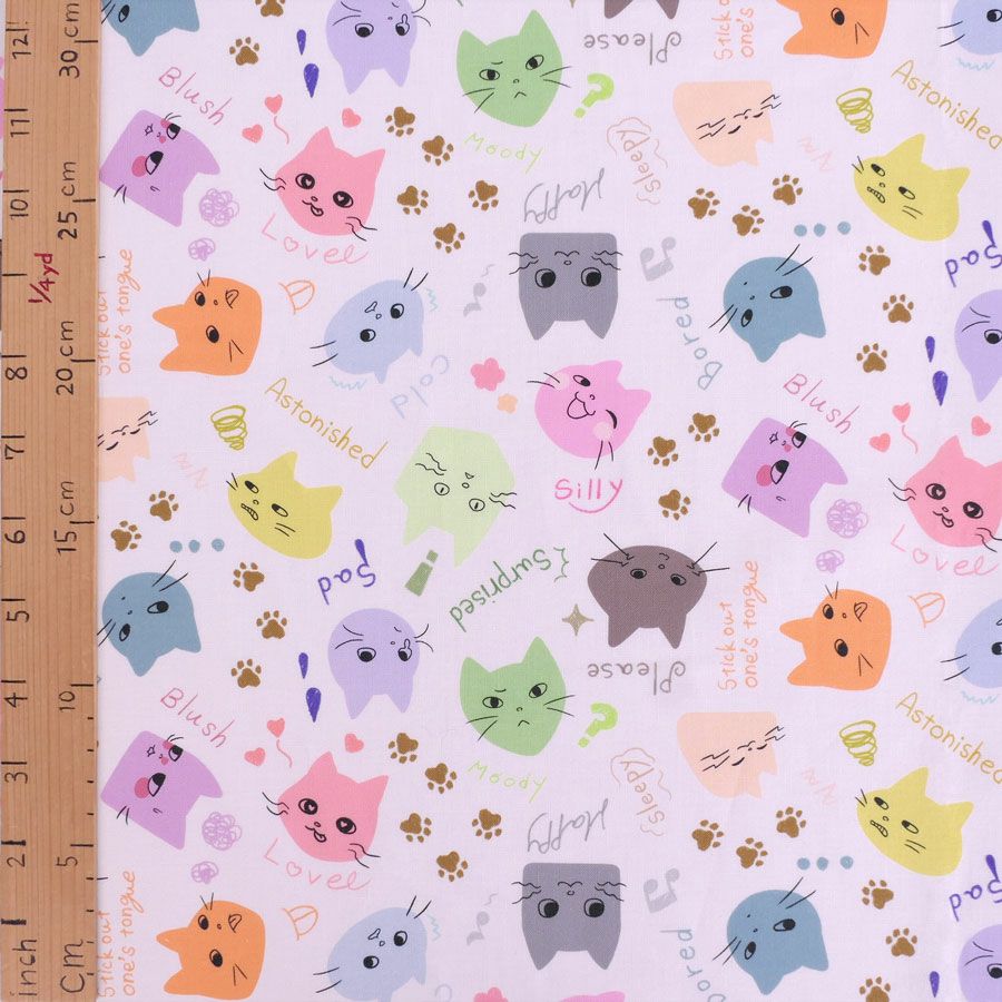 コットン生地 カラフル猫面相(白) 10cm単位 切り売り ネコ柄生地 猫柄木綿生地 ねこ柄布地 かわいい ポップな柄 nora