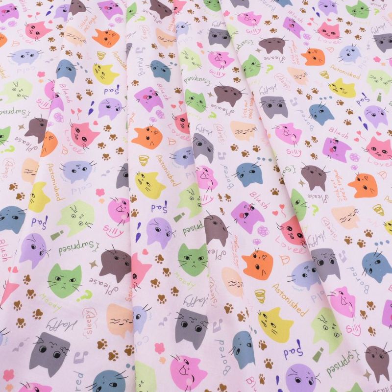 コットン生地 カラフル猫面相(白) 10cm単位 切り売り ネコ柄生地 猫柄木綿生地 ねこ柄布地 かわいい ポップな柄 nora