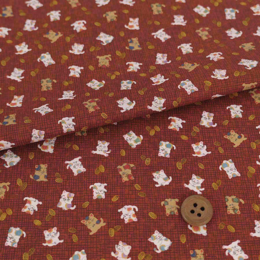 和柄コットン生地 招き猫に小判(れんが色) 10cm単位 切り売り