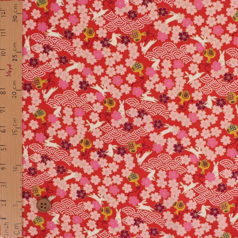 和柄コットン生地 うさぎと桜の吉祥文様(赤) 10cm単位 切り売り