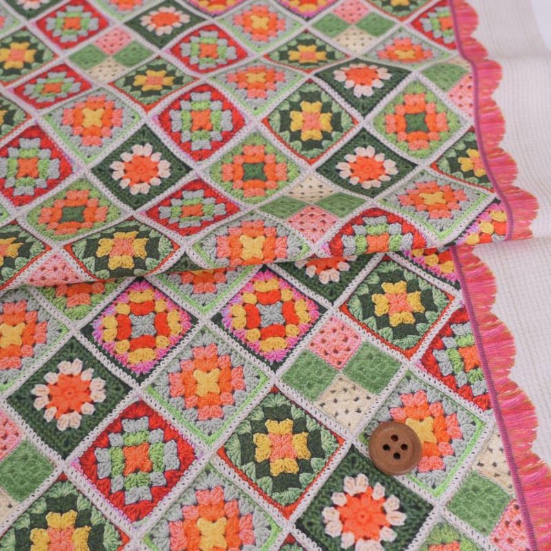 コットン生地 かぎ針編みのモチーフ柄(グリーンオレンジ) 10cm単位 切り売り