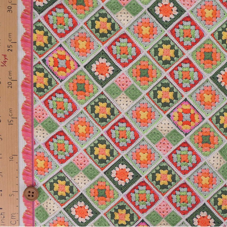 コットン生地 かぎ針編みのモチーフ柄(グリーンオレンジ) 10cm単位 切り売り