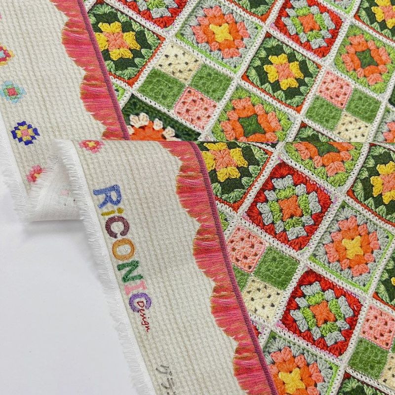 コットン生地 かぎ針編みのモチーフ柄(グリーンオレンジ) 10cm単位 切り売り