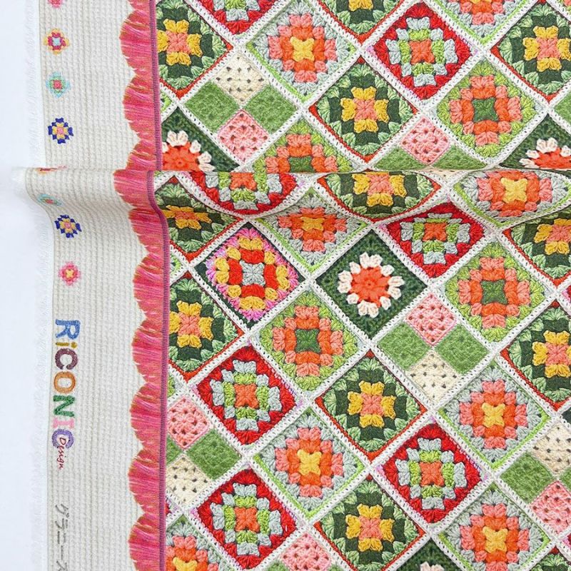 コットン生地 かぎ針編みのモチーフ柄(グリーンオレンジ) 10cm単位 切り売り