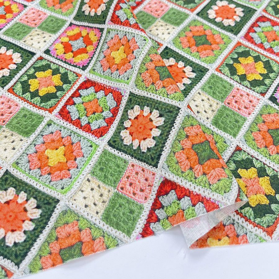 コットン生地 かぎ針編みのモチーフ柄(グリーンオレンジ) 10cm単位 切り売り
