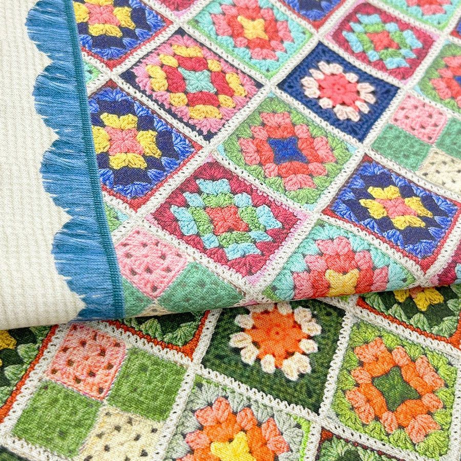 コットン生地 かぎ針編みのモチーフ柄(グリーンオレンジ) 10cm単位 切り売り